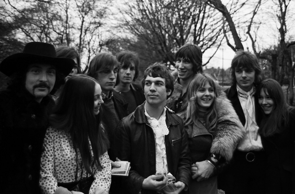 A black and white image of a group of friends in a London park.